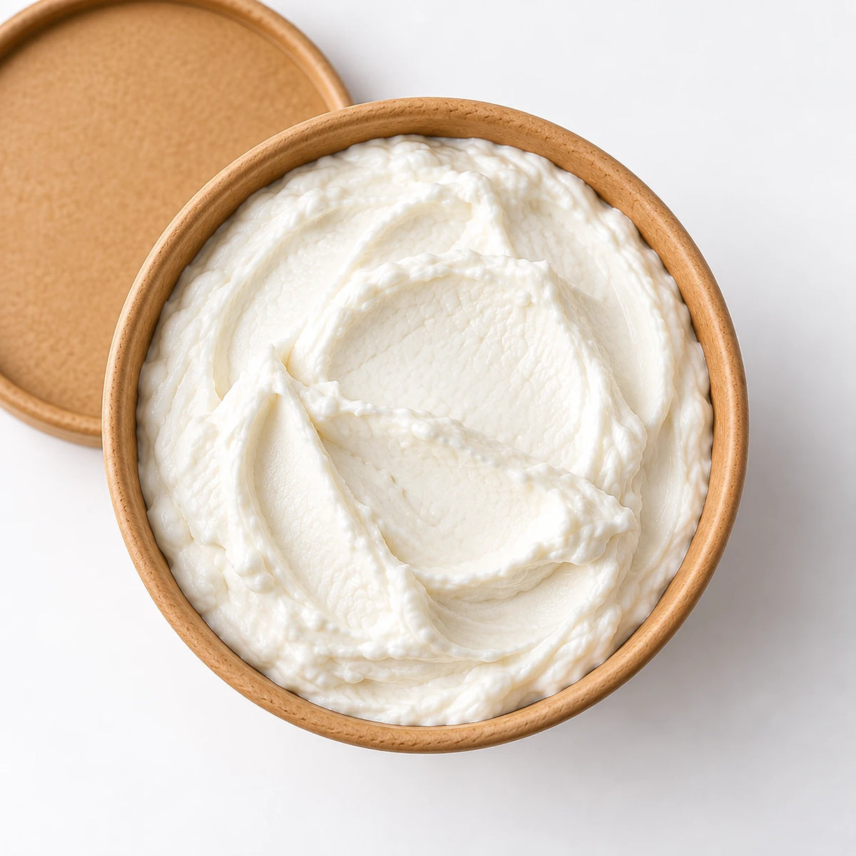 Greek yogurt in kraft tub - overhead view